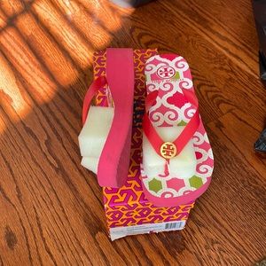Tory Burch wedge flip flops. Never worn in the box
